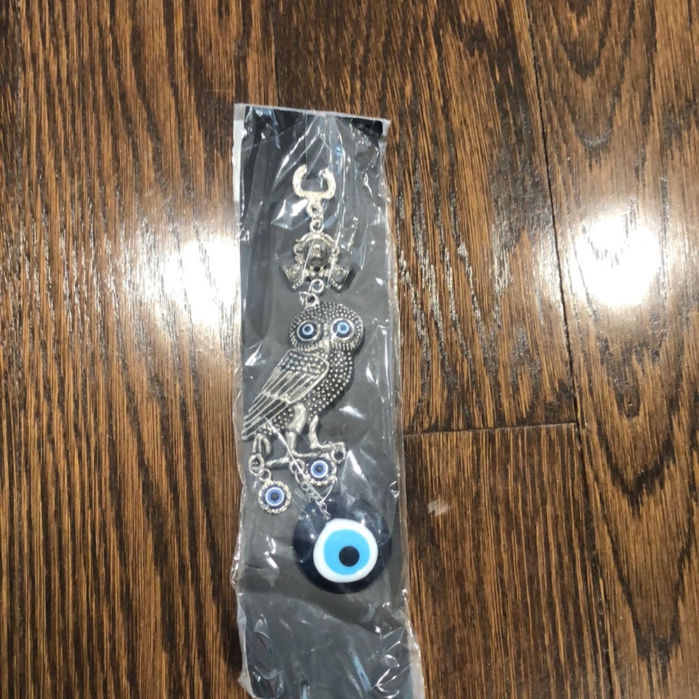 Accessory with owl and evil eye
